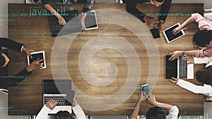 Collaborative Workspace with Diverse Team Engaged in Technology, Coding, and Programming Discussions in a Modern Office