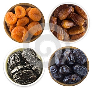 Collage of different dried fruits. Dried prunes, dried apricots and dates isolated on white background. Top view. Dried fruits iso