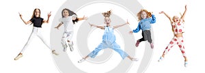 Collage of five cheerful, happy girls, children jumping isolated over white background