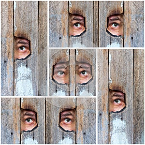 Collage of the human eye, voyeur spying through a hole in the old wooden fence