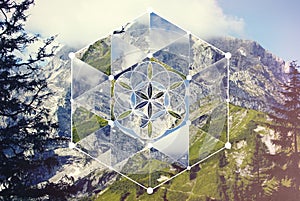 Collage with the mountain landscape and the sacred geometry symbol