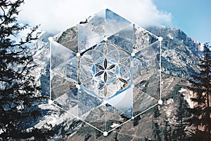 Collage with the mountain landscape and the sacred geometry symbol photo