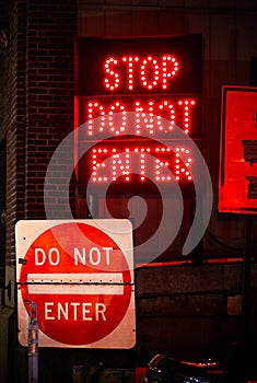 Collage of red street warning signs on city streets