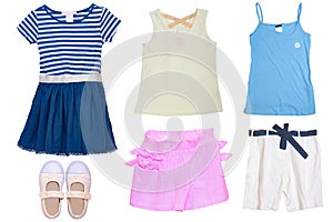 Collage set of little girl summer clothes isolated on a white background. The collection of a blue dress, two shirts, shoes, a