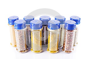 Different spices jars and pepper mill