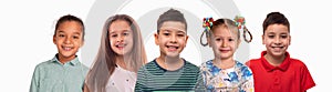 Collage  of the studio portraits of smiling schoolchilds  of different races ,  on white