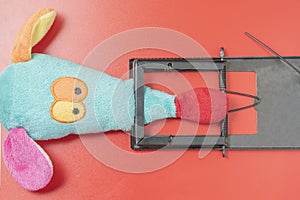 Collage of a toy mouse and a mousetrap