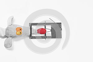 Collage of a toy mouse and a mousetrap