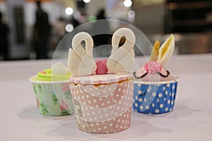 Collage of various cupcakes in decorative cup