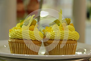 Collage of various cupcakes: vanilla in decorative cup