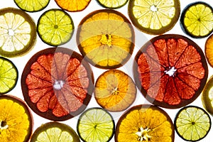 Collage of various fruit slices isolated on a white background