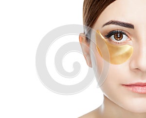 Collagen gold patches on the skin of the eyelid, on the face photo