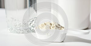 Collagen or protein peptides in powder on white table. protein powder for making whey drink or collagen cocktail for