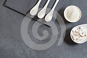 Collagen protein powder with spoon measure isolate on white background. photo