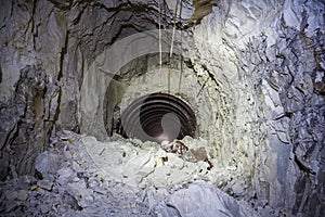 The collapse in the chalk mine, tunnel with traces of drilling machine