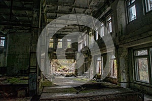 Collapsed, abandoned, messy, old. creepy, room with windows covered in the building located in the Chernobyl ghost town