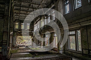 Collapsed, abandoned, old. creepy, room with windows covered in the building located in the Chernobyl ghost town