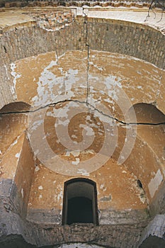 collapsed building. the door on the second floor leads to an abyss