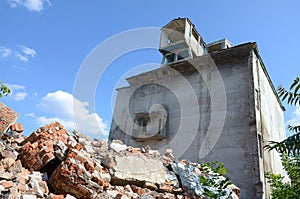 Collapsed industrial multistorey building in daytime