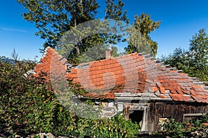collapsed roof from a abandoned house in the country