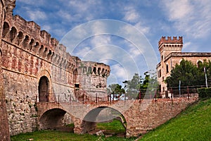 Colle di Val d`Elsa, Siena, Tuscany, Italy: the ancient city walls with moat, bridge and city gate photo