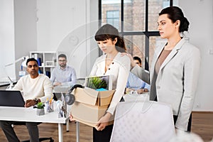 Colleague soothing sad fired female office worker