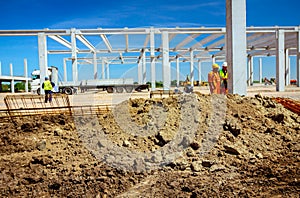 Colleague of workers is talking on construction site