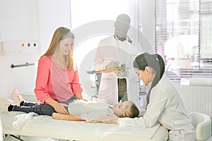 colleagues doctors examining health of girl patient