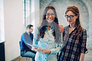 Colleagues having coffee break in modern office