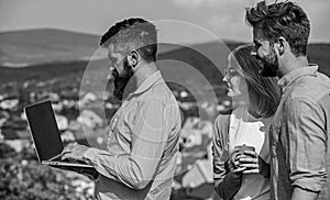 Colleagues with laptop work outdoor sunny day, nature skyline background. Business partners meeting non formal