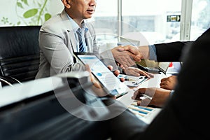 Colleagues male entrepreneurs in meeting room at creative office discussing accounting trade and experience about proud ceo in