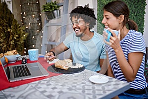 Colleagues male and female working at laptop