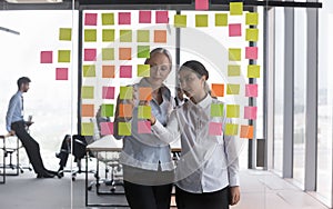 Colleagues prepare plan writing ideas, thoughts use multicolored sticky notes