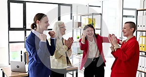 Colleagues rejoice and applaud, close-up, slowmotion