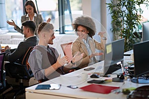 Colleagues talking, smiling, explaining with hands, gesticulate in modern open space office. indoor, open space, modern, casual,