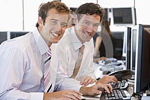 Colleagues Working Together At Computer