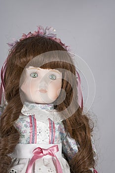 Collectable Porcelain doll on white photo