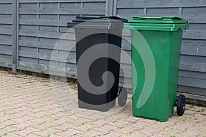 Collected kerbside waste bins on street photo