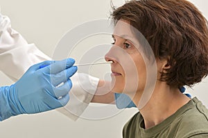 Collecting a nasopharyngeal nose and throat swab