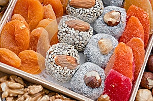 Collecting nuts and dried berries. Assorted dried fruits in a wooden box. Close-up