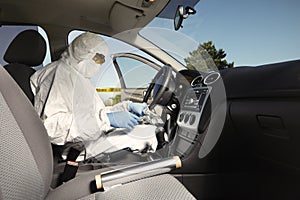 Collecting of odor traces by criminologist from drive wheel