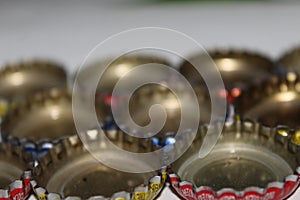 A collection of aluminum lids on soft drinks