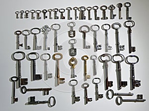 A Collection of 48 Antique Keys on white background photo