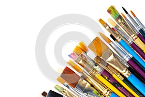 A collection of artists paint brushes on a white background