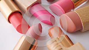 Assorted lipsticks in various shades, showcasing vibrant colors and textures