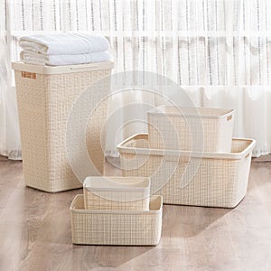 Collection of baskets and bins arranged on the floor.