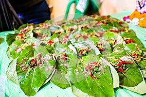 Collection of betel leaf banarasi paan and fire paan displayed for sale at a shop with selective focus and blurred