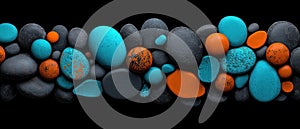 A collection of black and blue stones arranged in a row.