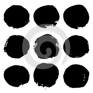 Collection of black grunge paint circles, stains. Brush strokes isolated on white background. Vector illustration.