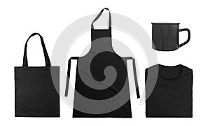 Collection of black objects isolated on white background. Black cotton bag, black folded t-shirt, kitchen apron, metal